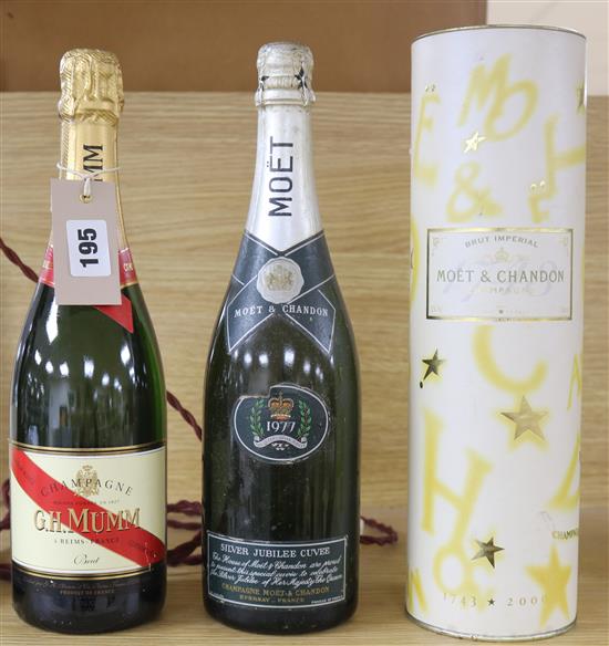 A bottle of 1977 silver Jubilee Moet and Chandon Champagne, another and a Mumm Champagne